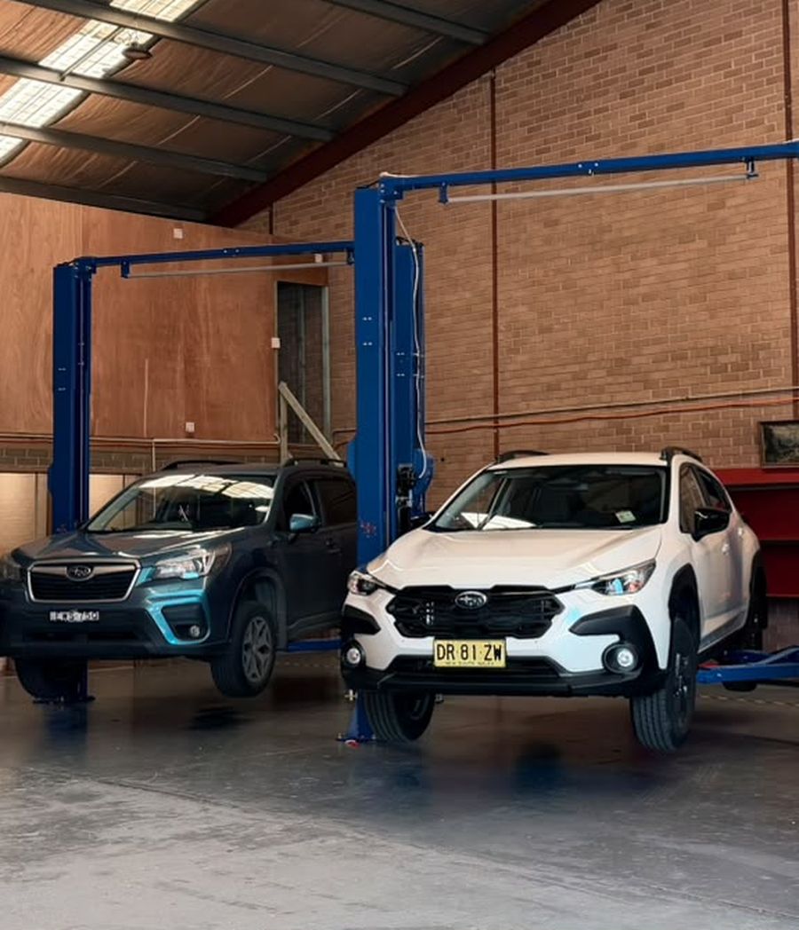 Vehicle raised on a hoist for inspection